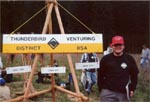 Little Matt next to the Venturing Sign